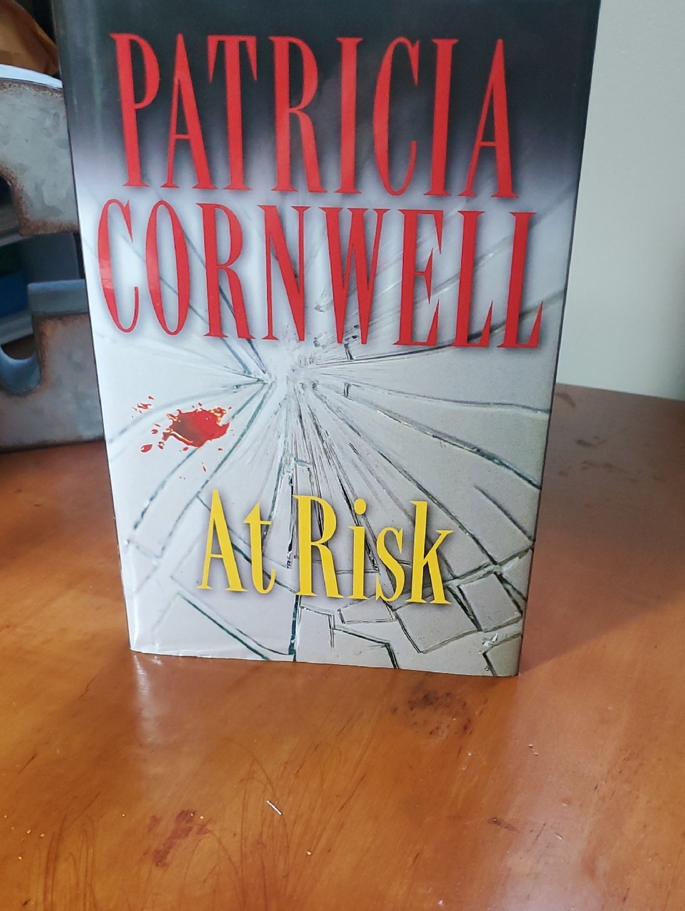 Patricia Cornwell "At Risk" Hardcover Book - Red, Yellow, Gray